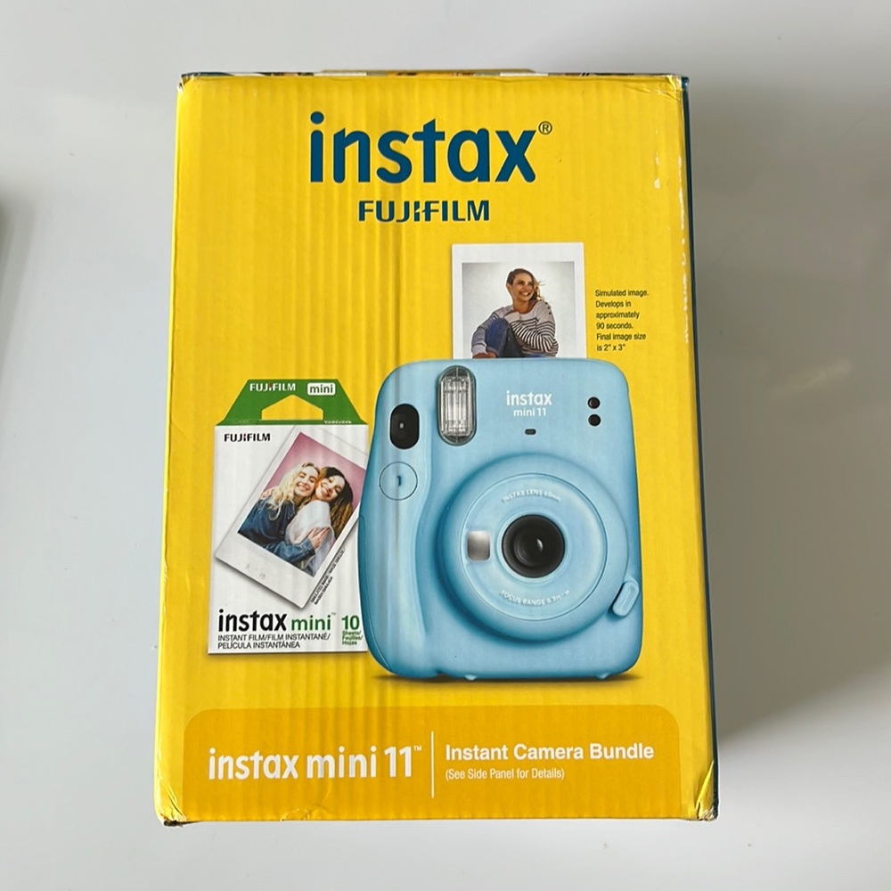 Brand new Instax Mini 11 with 10 film. Sky blue.